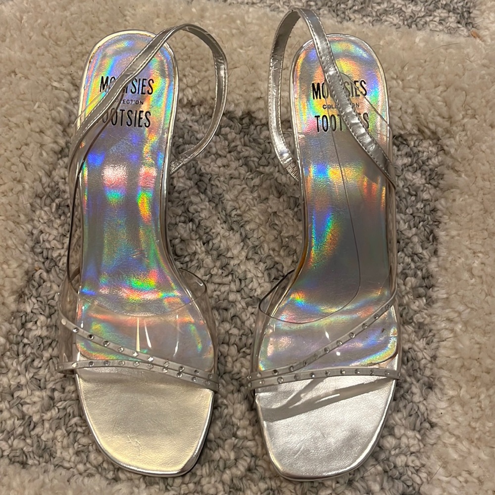 Clear and silver pumps